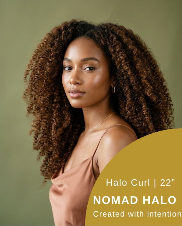 Woman wearing Halo Curl human hair crochet extensions in 22 inch curly texture